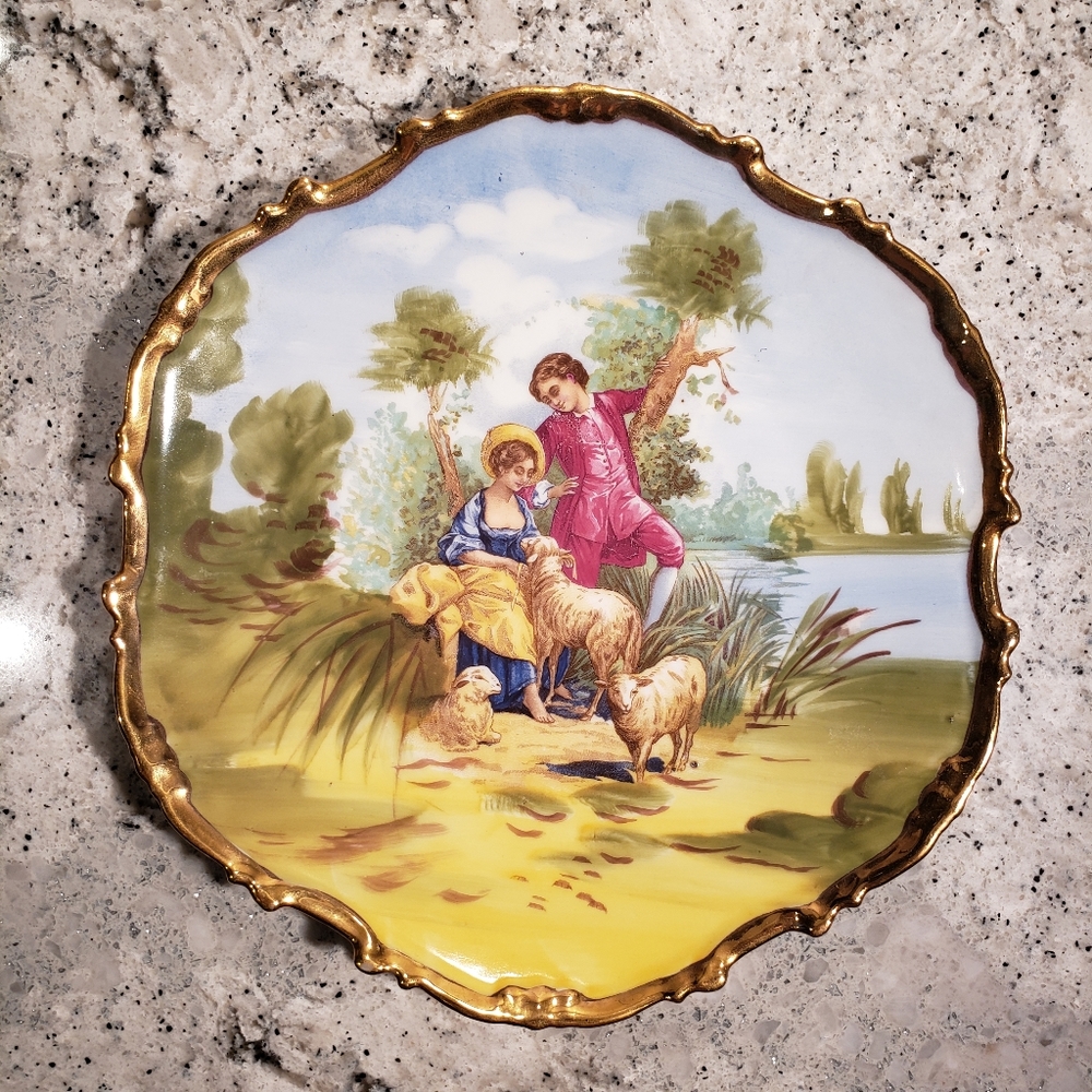 Limoges Large antique plate with 24ktg trim.